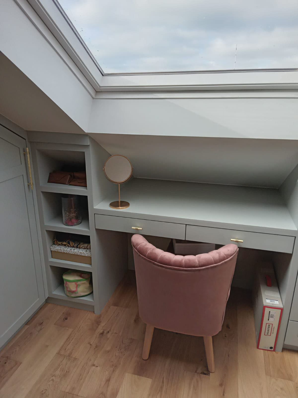 Built-in dressing table under a loft skylight