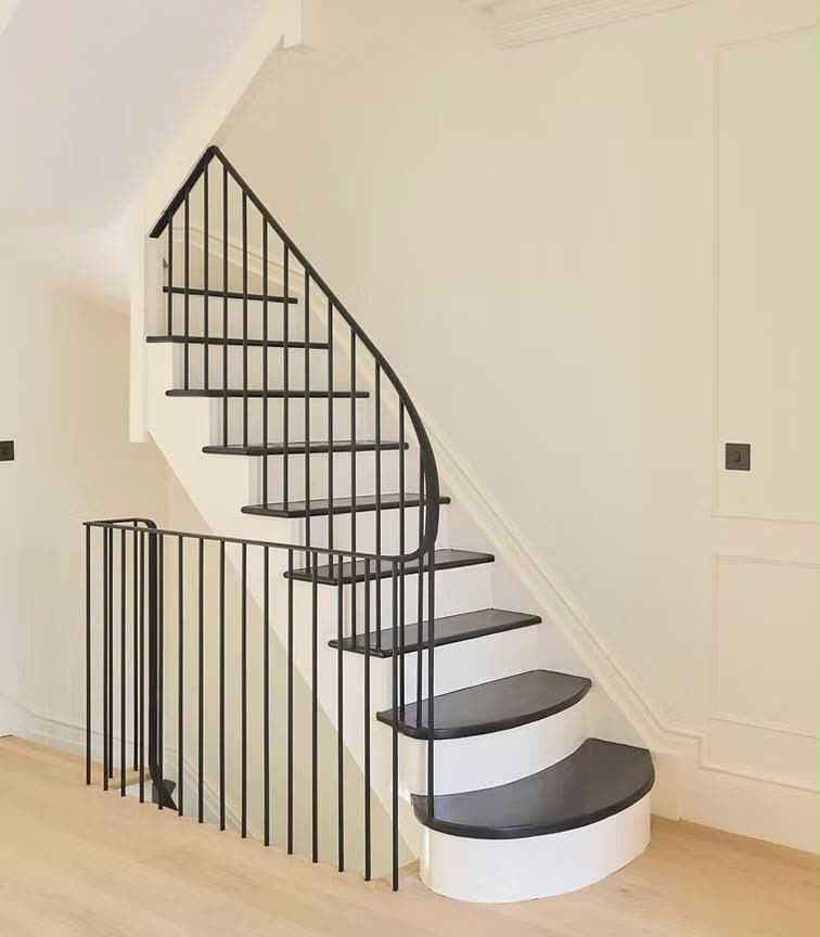 Curved black steel staircase