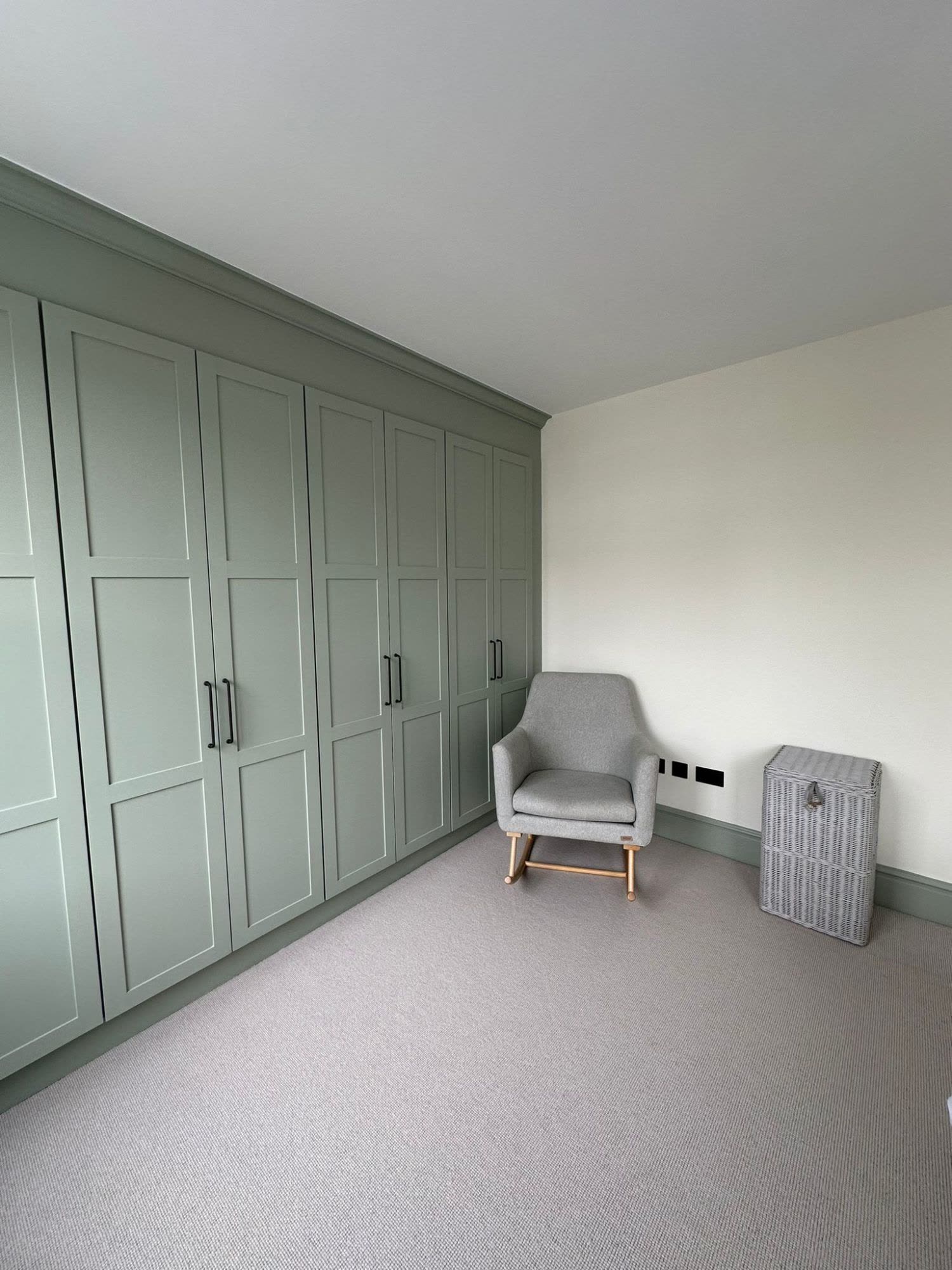 Sage green fitted shaker wardrobes, wall to wall