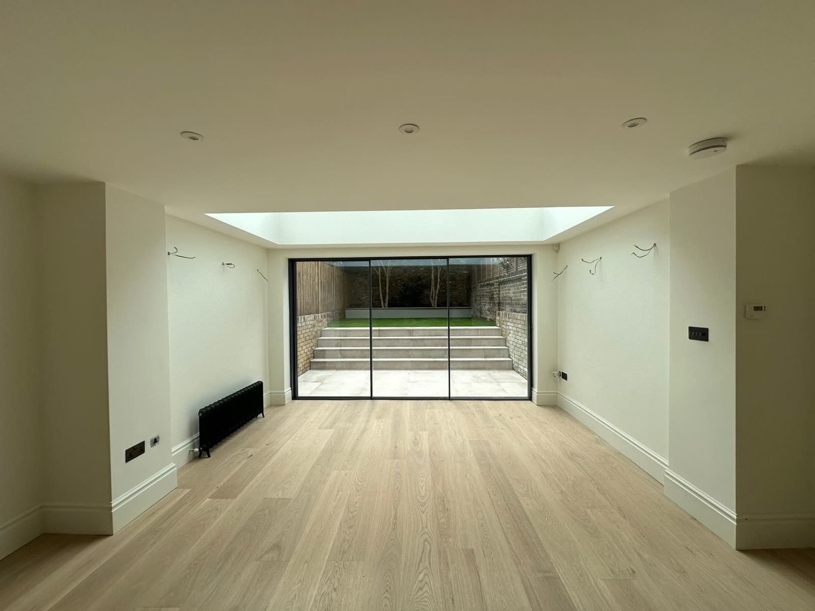 Renovated living space opening to the garden